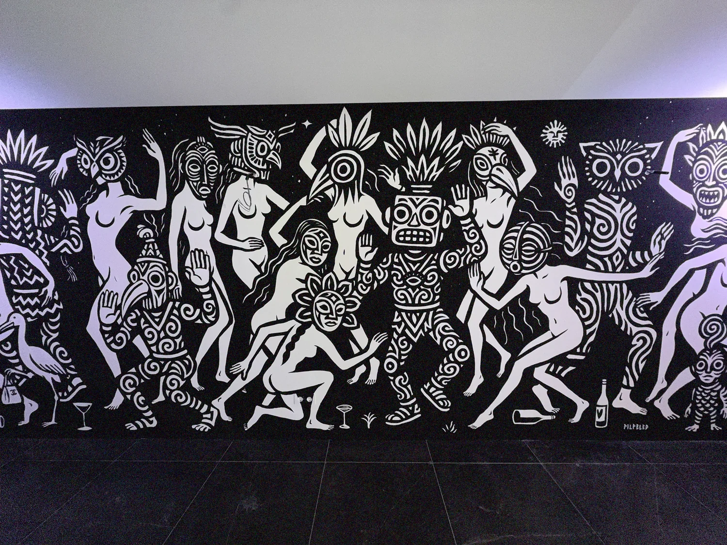 A Pilpeled mural on a courtyard wall