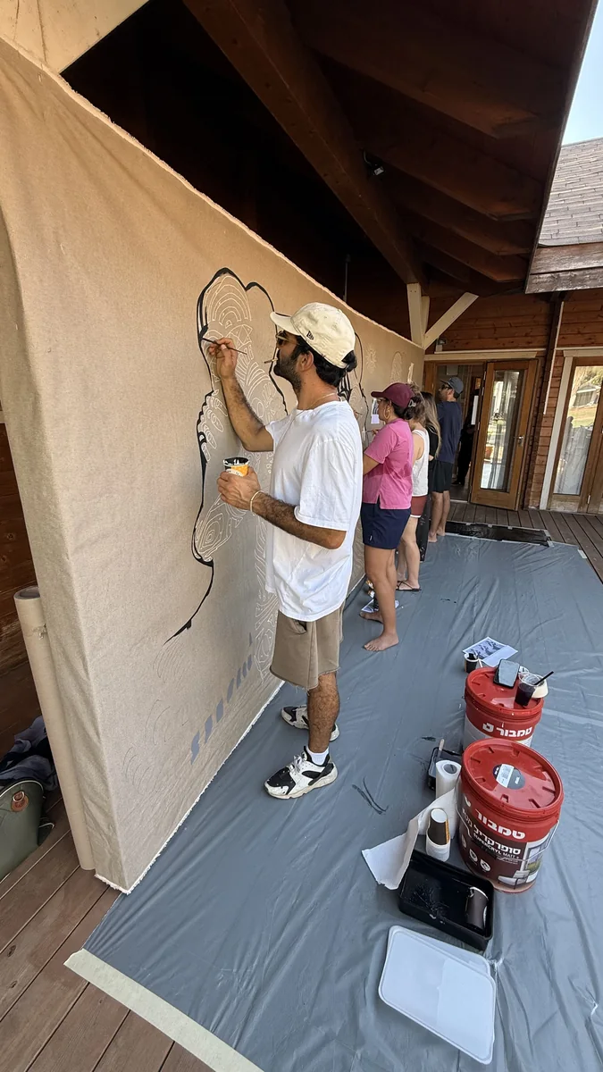 Working on a wall at night