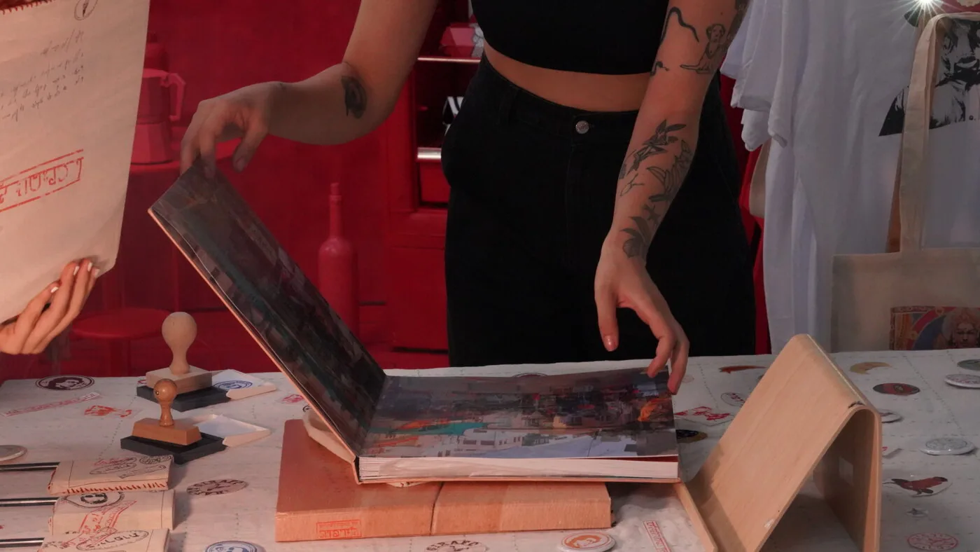 A visitor stamping an album cover