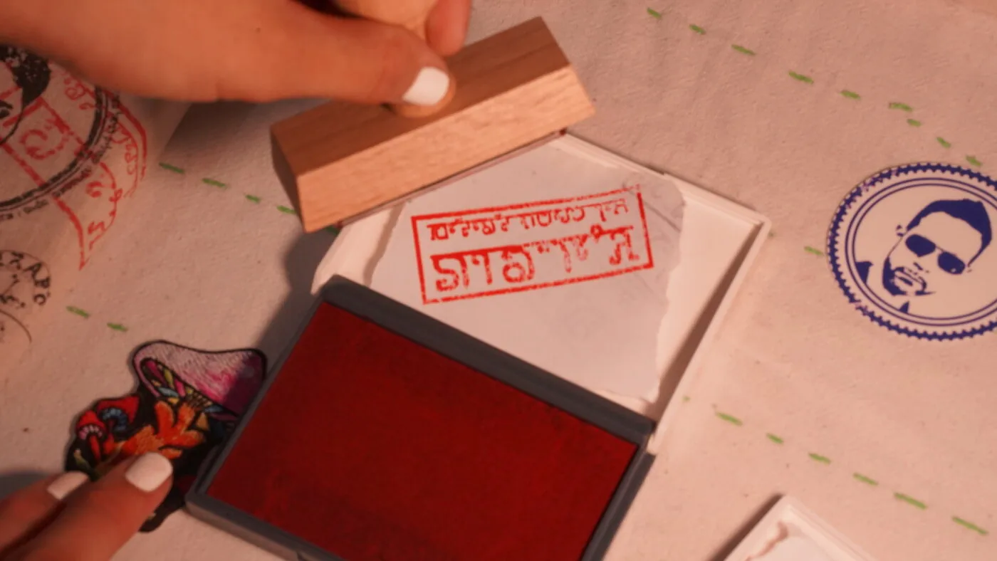 Hands pressing the band stamp onto a cover