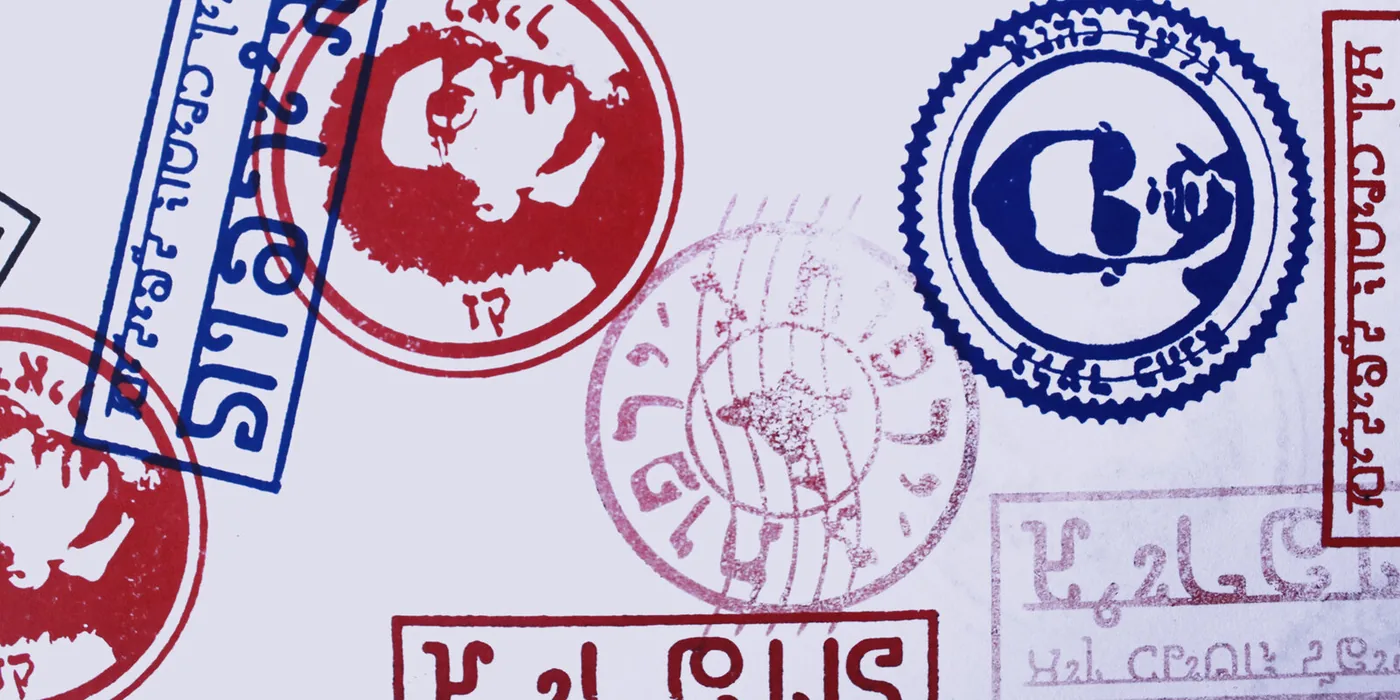 The stamp sheet — the band's faces as postal seals