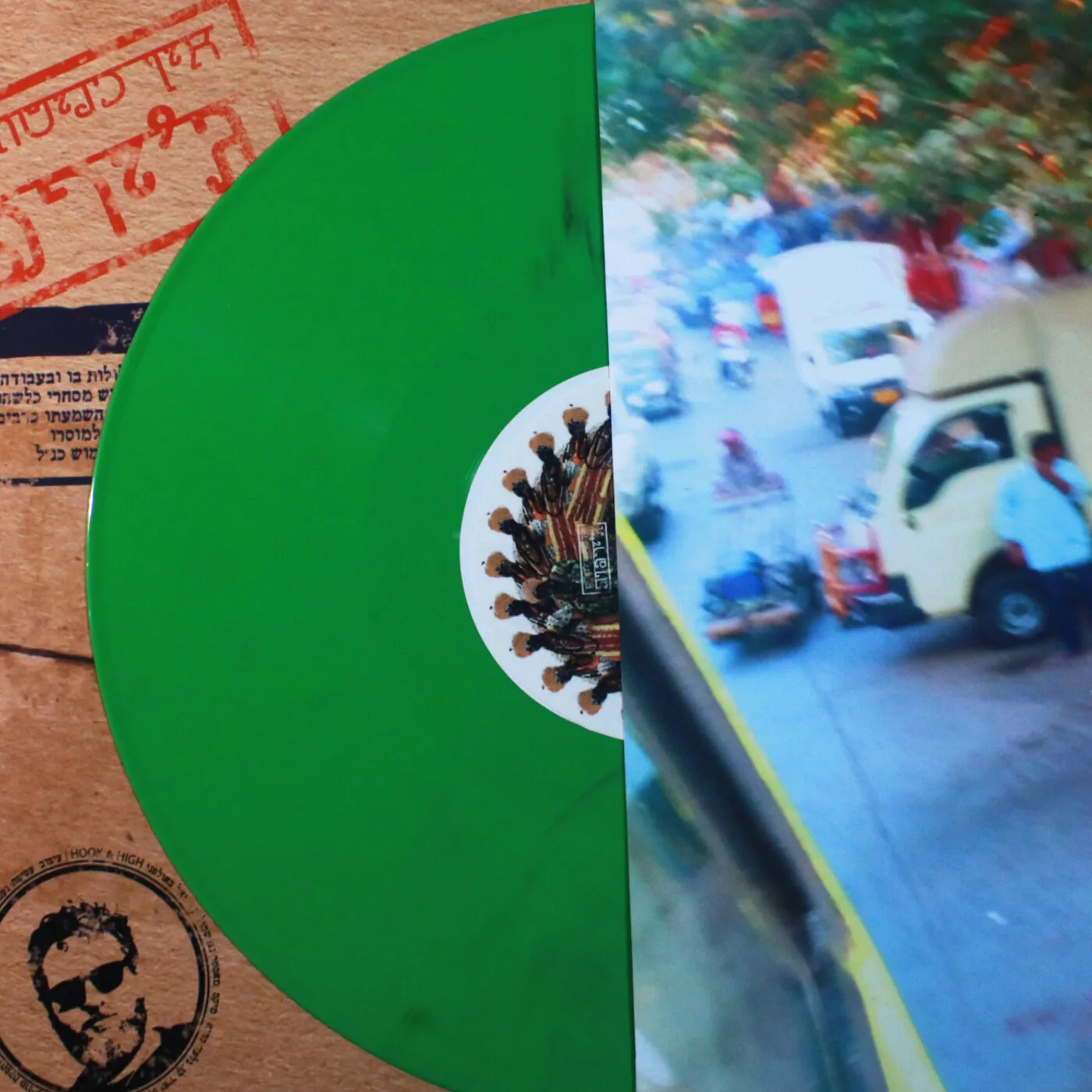 The green vinyl sliding out of the stamped inner sleeve