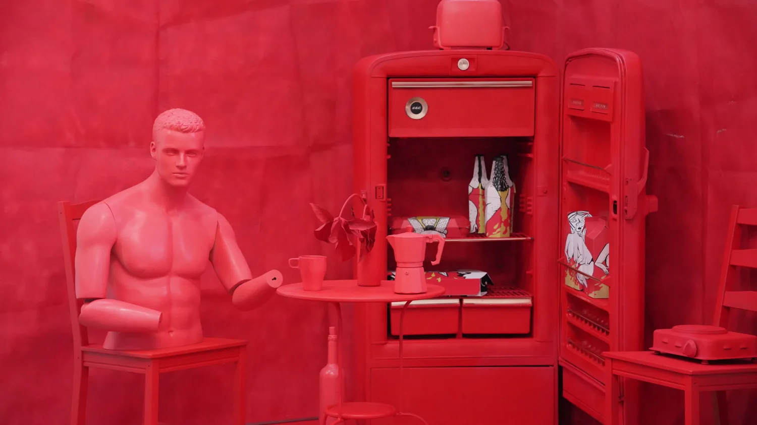A figure standing at the open fridge