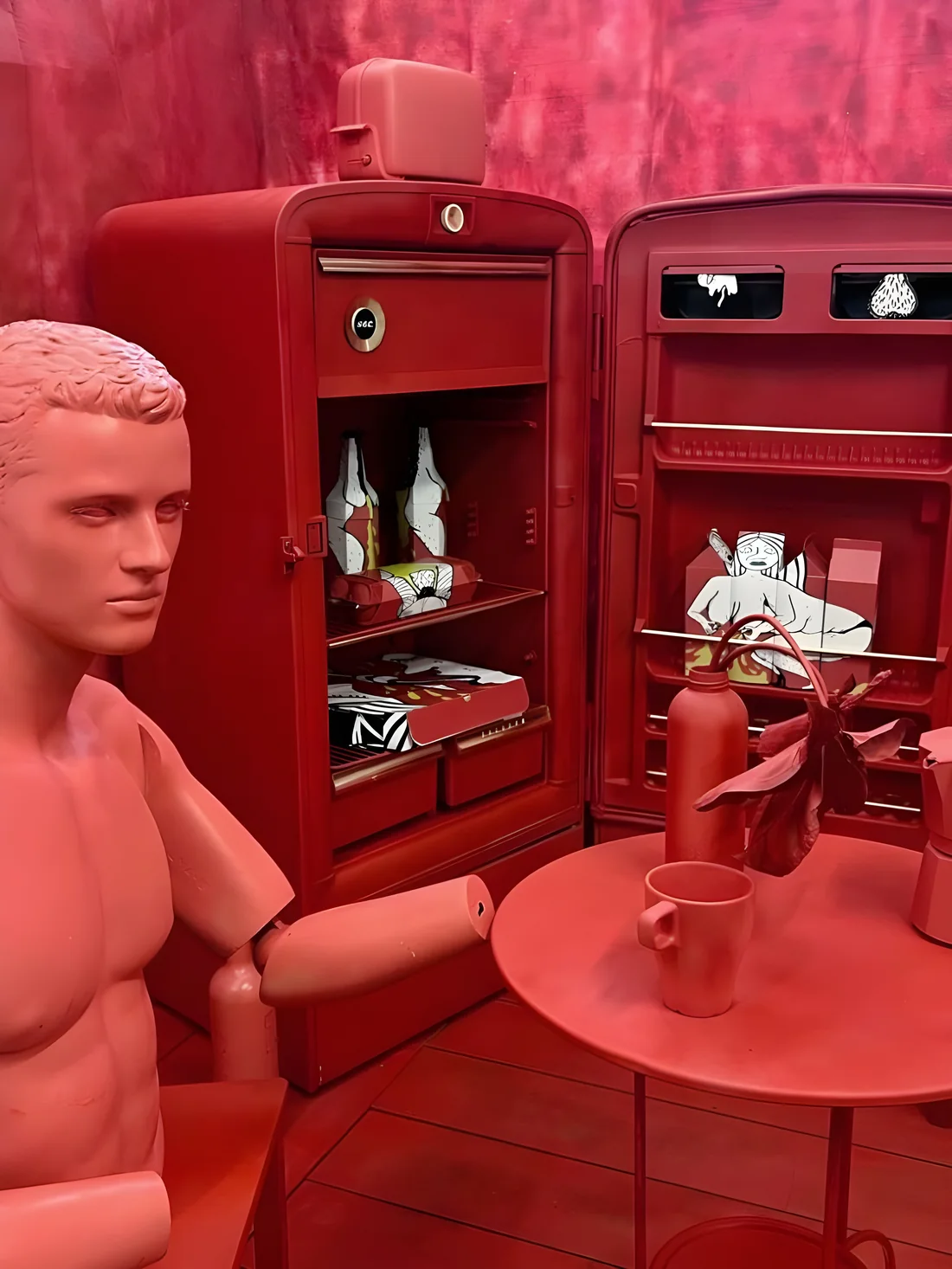 The red room from the doorway — fridge, table and figure
